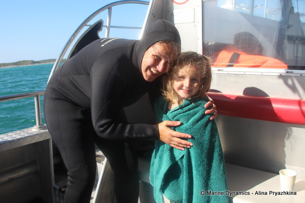 Young diver on shark cage diving boat marine dynamics